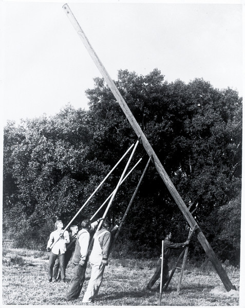 Linemen set pole for rural electrification