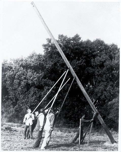 Linemen set pole for rural electrification