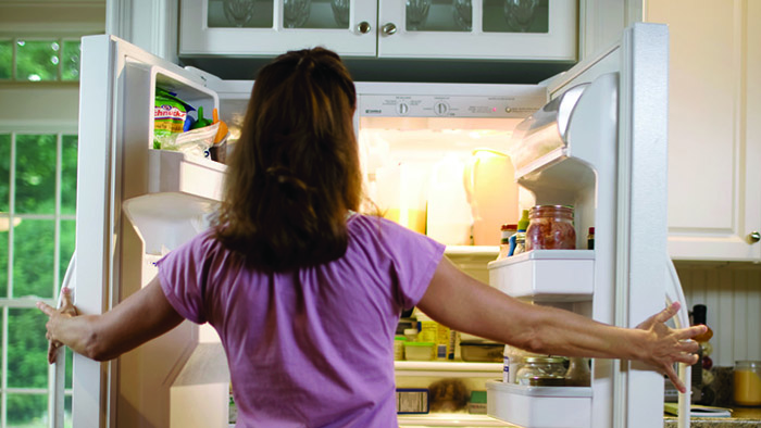 Women looking in refrigerator
