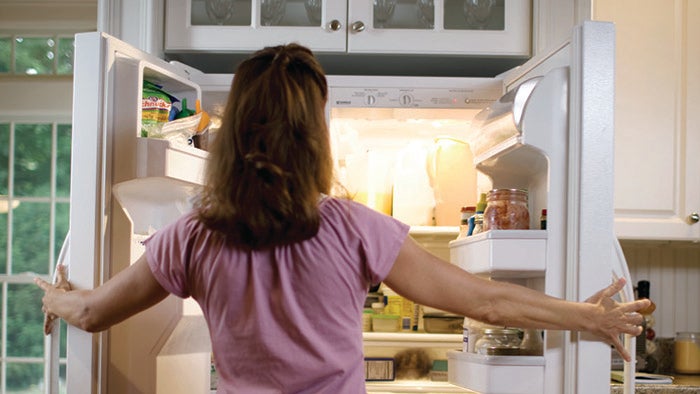 Women looking in refrigerator